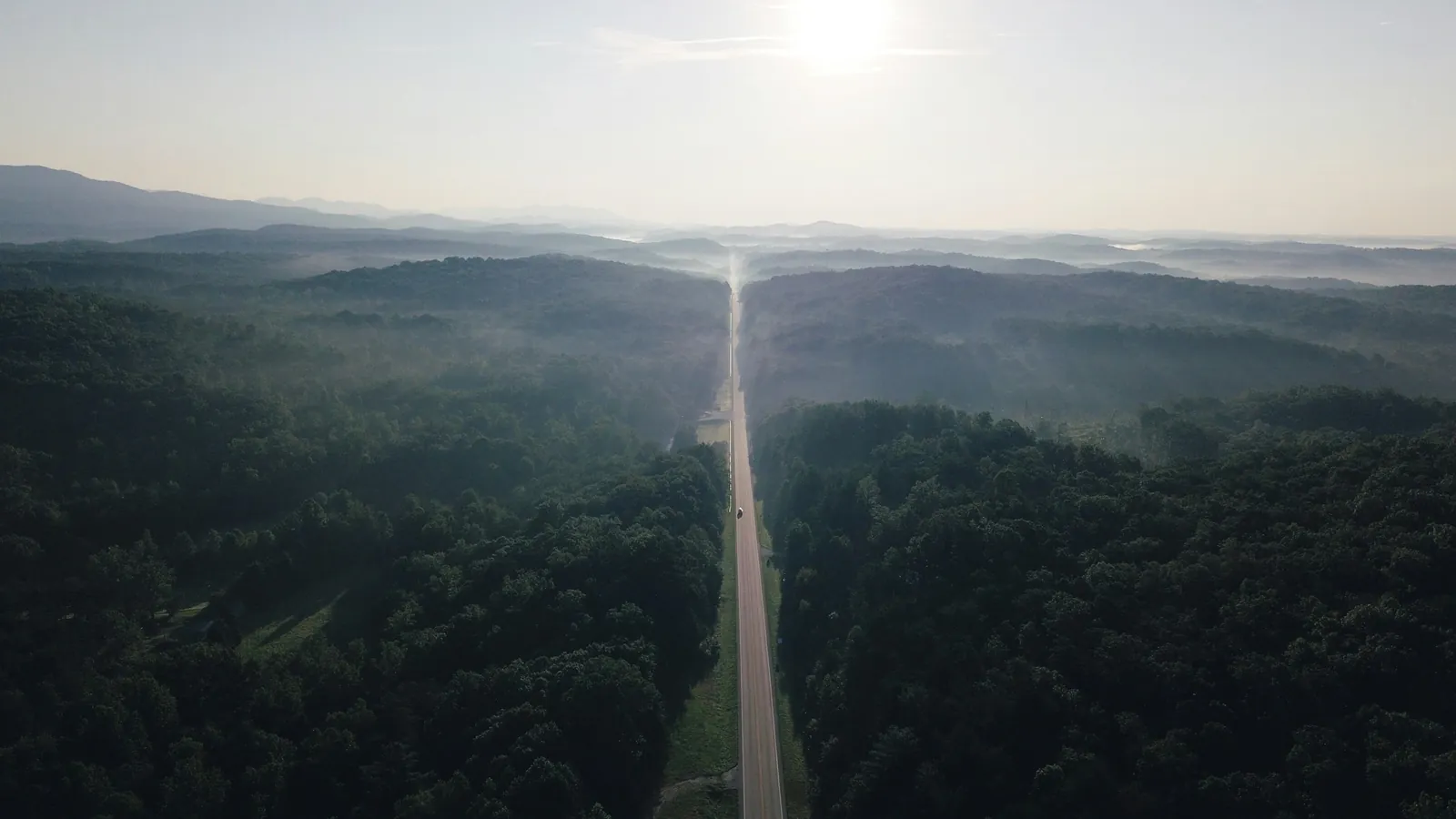 Aerial view of the Cherokee Foothills Scenic Highway (SC-11) running through forested foothills near Pickens, South Carolina