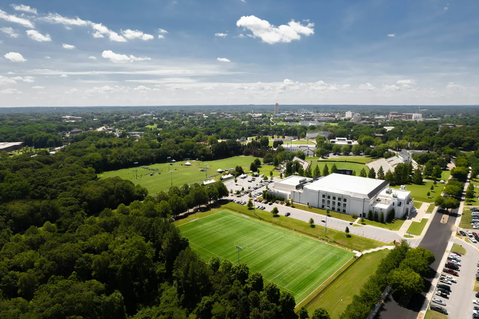 Aerial view over Wofford College toward the downtown Spartanburg, South Carolina skyline on a sunny day