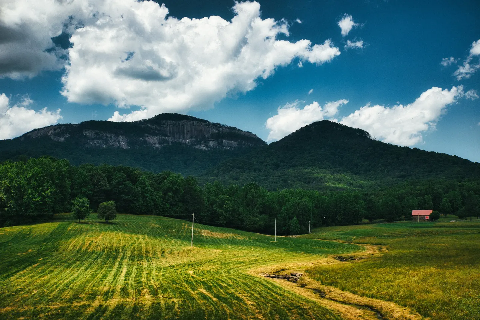 Table Rock Mountain rising above a green farm pasture near Pumpkintown in Pickens County, South Carolina